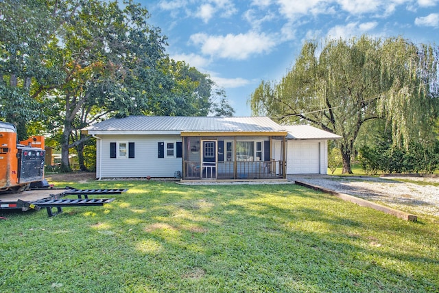 ranch-style house featuring a garage and a front lawn