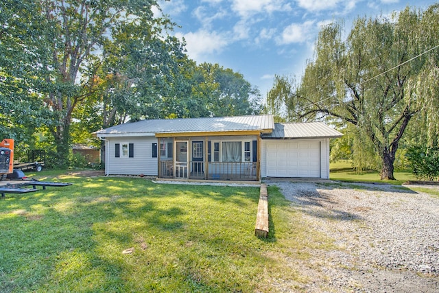 ranch-style house with a garage and a front yard