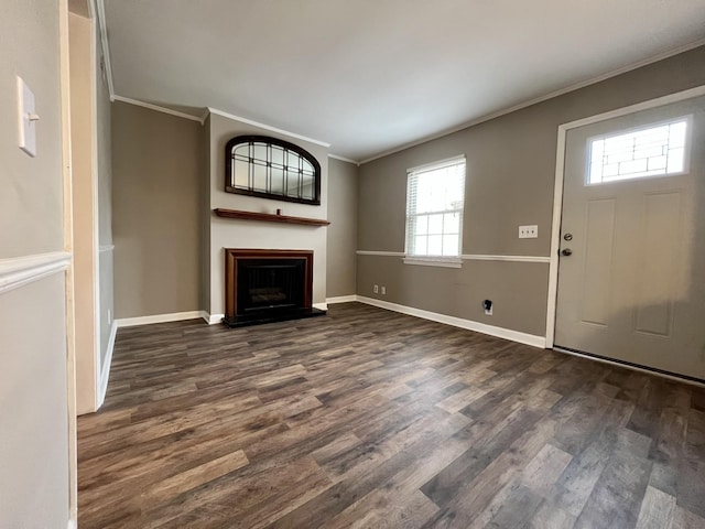 unfurnished living room with crown molding and dark wood-type flooring