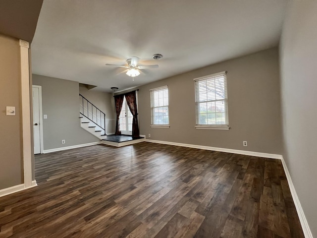 spare room featuring ceiling fan and dark hardwood / wood-style flooring