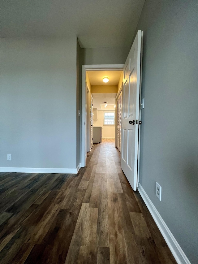 hall with dark hardwood / wood-style floors