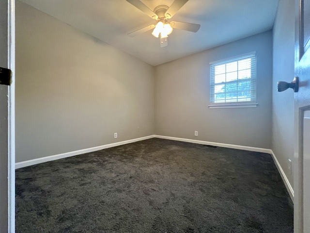 carpeted empty room with ceiling fan