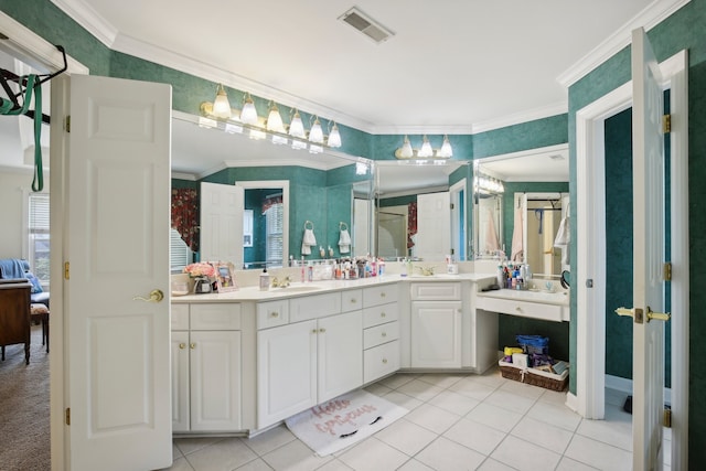 bathroom with crown molding, tile patterned floors, and vanity