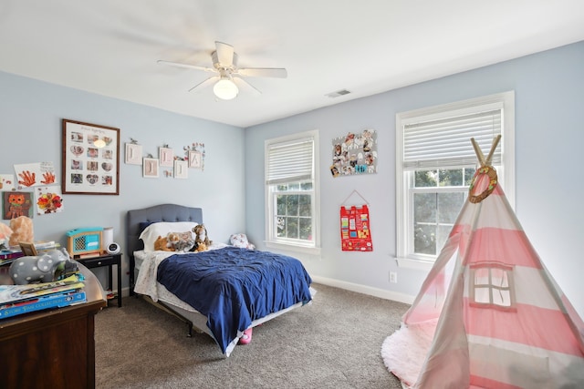 bedroom with multiple windows, carpet floors, and ceiling fan