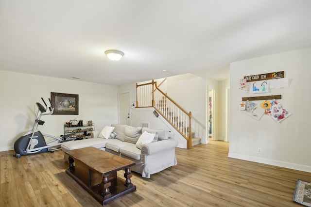 living room with light hardwood / wood-style flooring