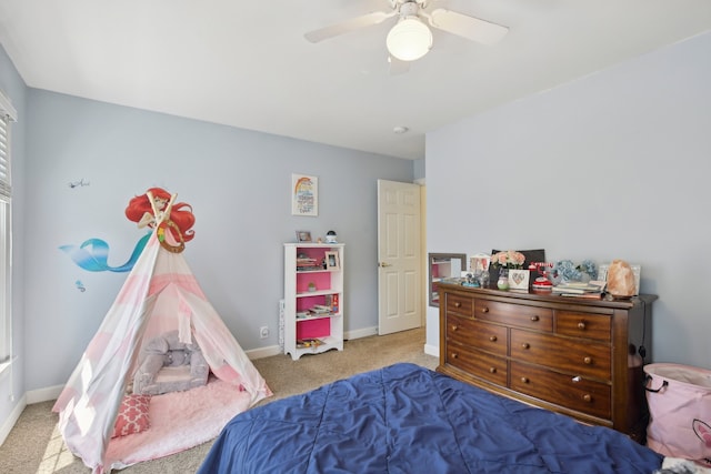 bedroom with ceiling fan and light colored carpet