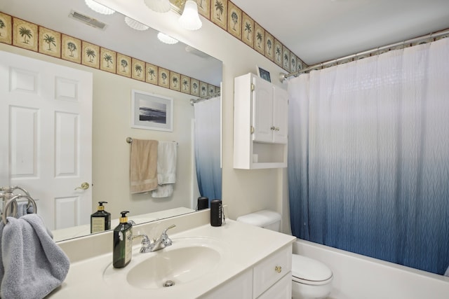 full bathroom with vanity, toilet, and shower / bath combo with shower curtain