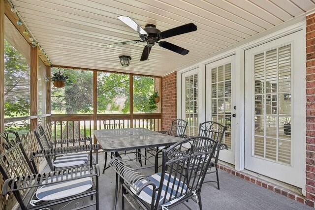 sunroom featuring wooden ceiling and ceiling fan