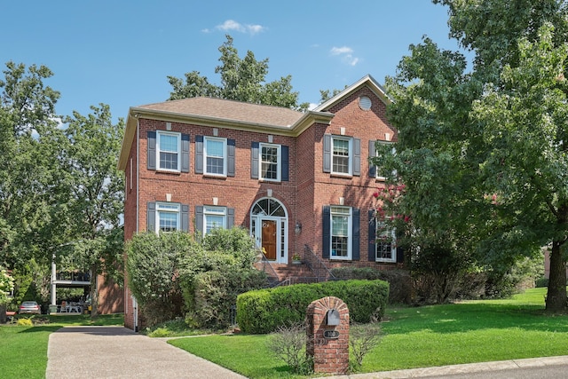 view of front of home with a front yard