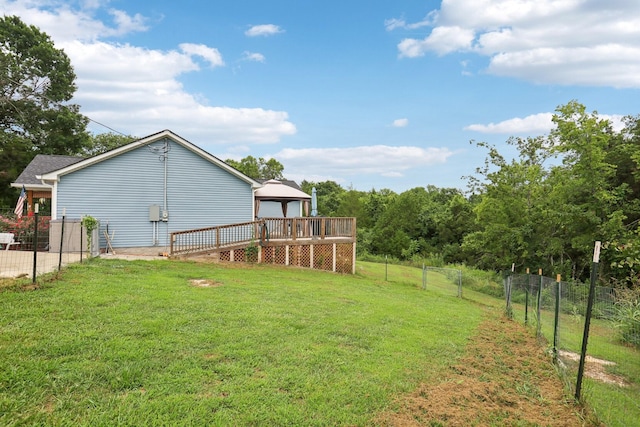 view of yard with a wooden deck and a gazebo