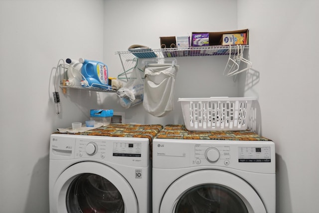 clothes washing area featuring independent washer and dryer