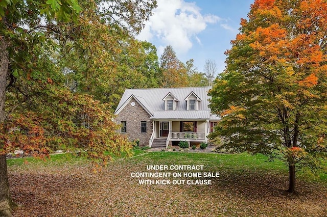 cape cod home featuring a porch