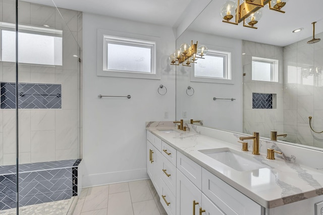 bathroom with vanity and a tile shower