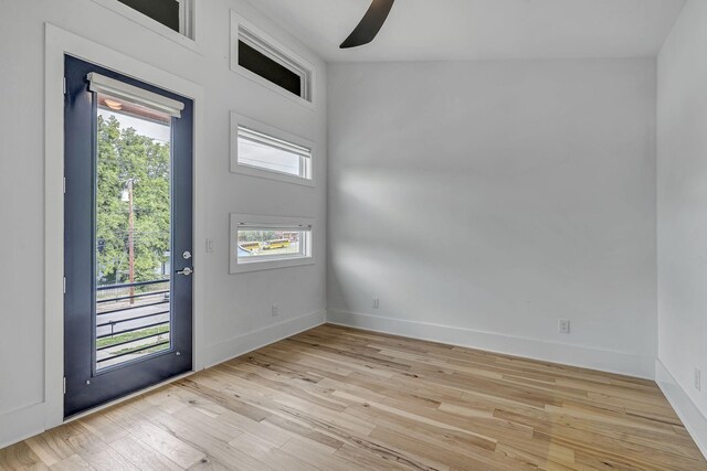 entrance foyer featuring ceiling fan, plenty of natural light, and light hardwood / wood-style floors