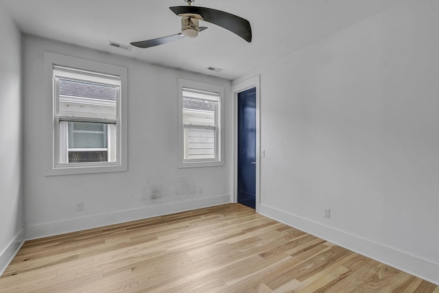 spare room featuring ceiling fan and light wood-type flooring