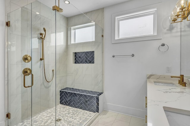 bathroom with vanity and a shower with door