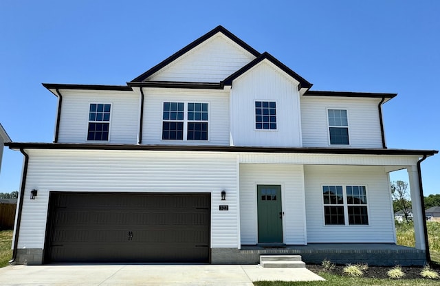 view of front of house featuring covered porch and a garage