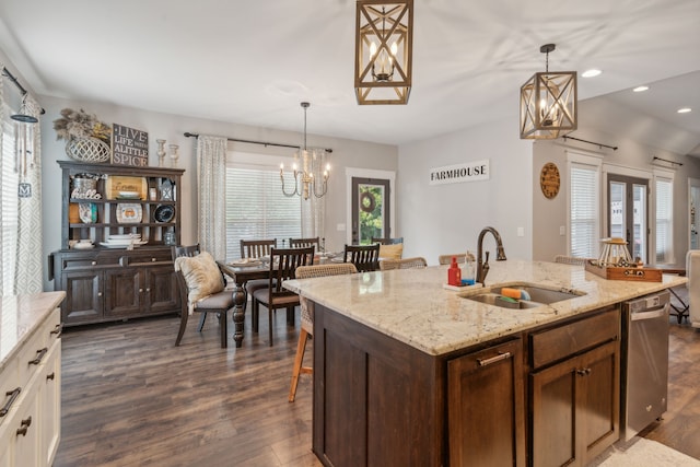 kitchen featuring sink, stainless steel dishwasher, dark wood-type flooring, and white cabinetry