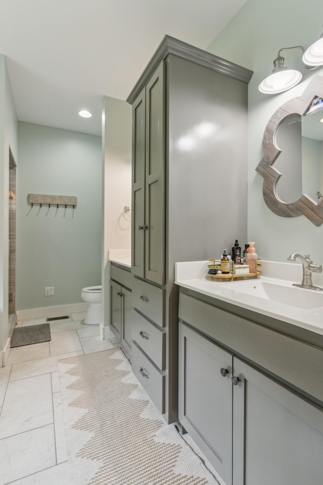 bathroom with tile patterned floors, toilet, and vanity