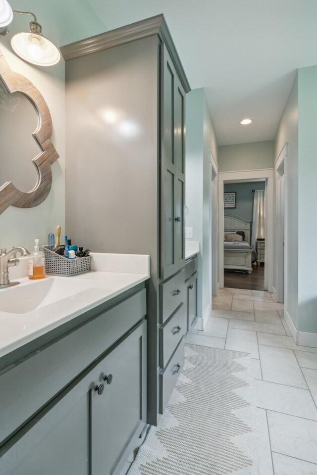 bathroom with vanity and tile patterned floors