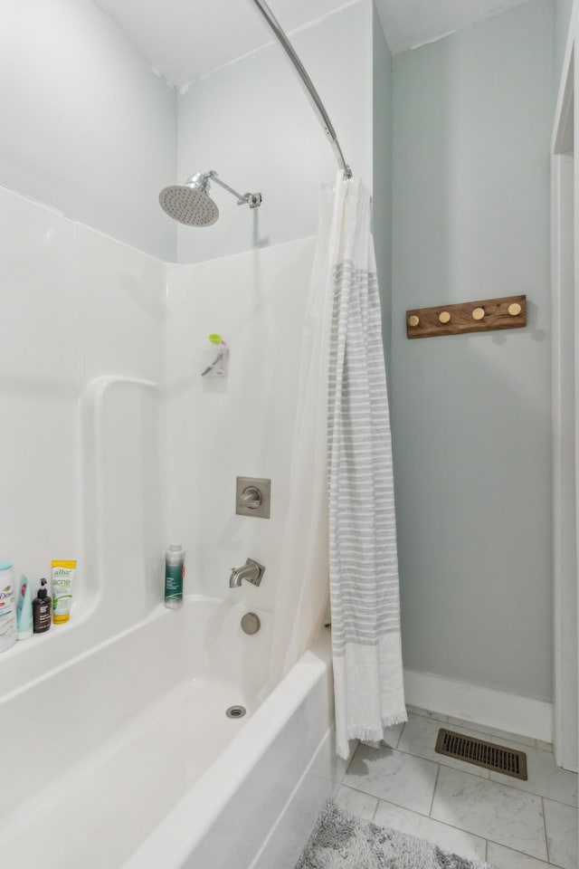 bathroom featuring tile patterned floors and shower / tub combo