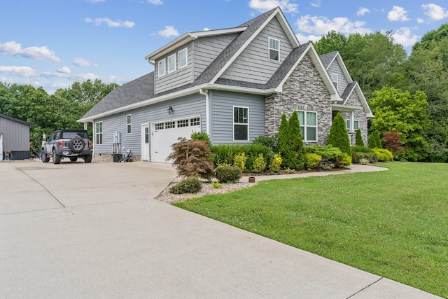 view of front of property with a garage and a front lawn