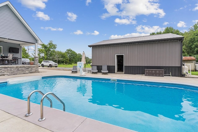 view of swimming pool featuring a patio