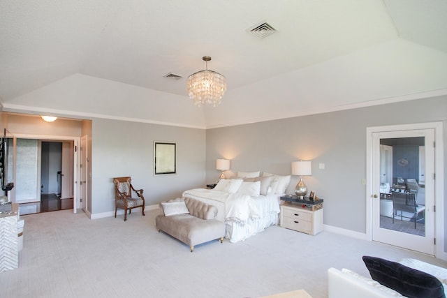 carpeted bedroom with a notable chandelier and vaulted ceiling