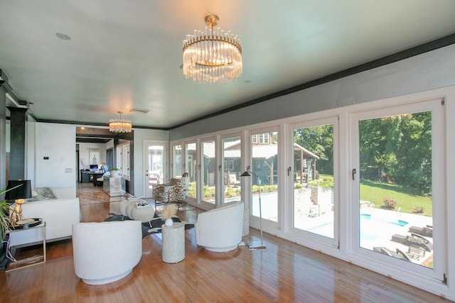 living room featuring hardwood / wood-style flooring and a notable chandelier