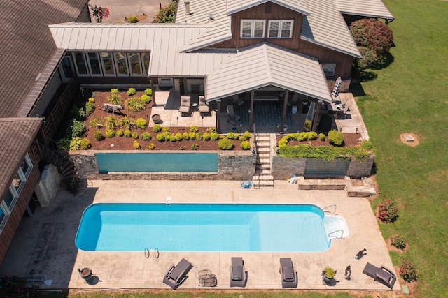 view of swimming pool with a patio area