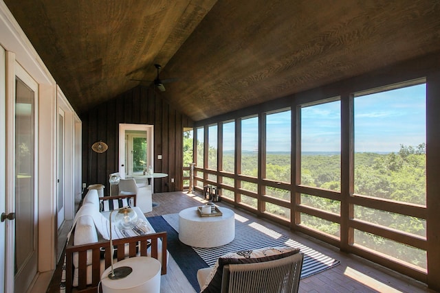 sunroom / solarium featuring vaulted ceiling and wooden ceiling