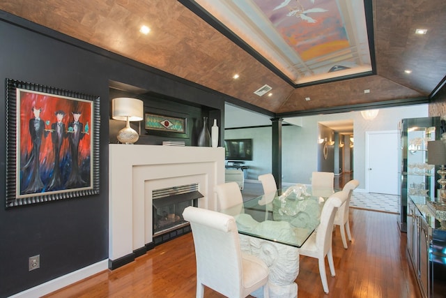 dining area with hardwood / wood-style flooring and lofted ceiling