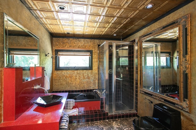 bathroom featuring shower with separate bathtub