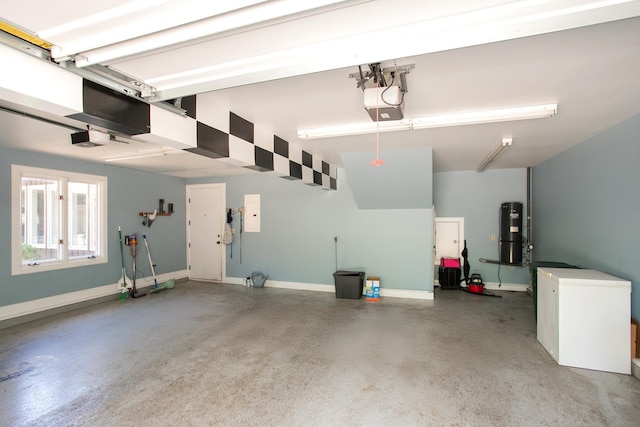 garage featuring a garage door opener, fridge, and water heater