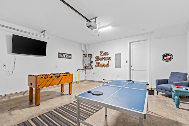 game room featuring concrete flooring, electric panel, and water heater