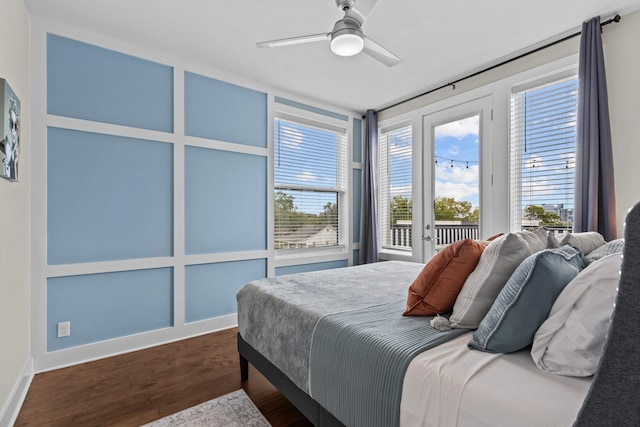 bedroom featuring dark wood-type flooring, access to outside, and ceiling fan