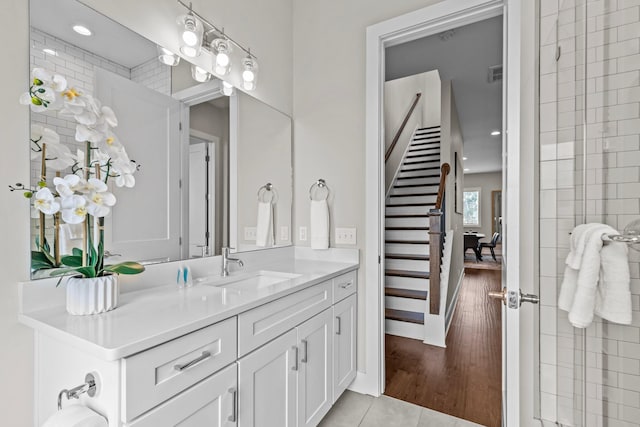 bathroom with tile patterned flooring and vanity