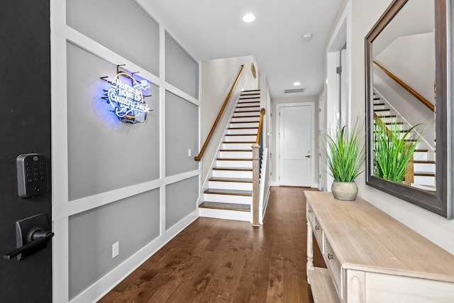 foyer with dark hardwood / wood-style flooring