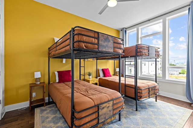 bedroom featuring dark wood-type flooring and ceiling fan