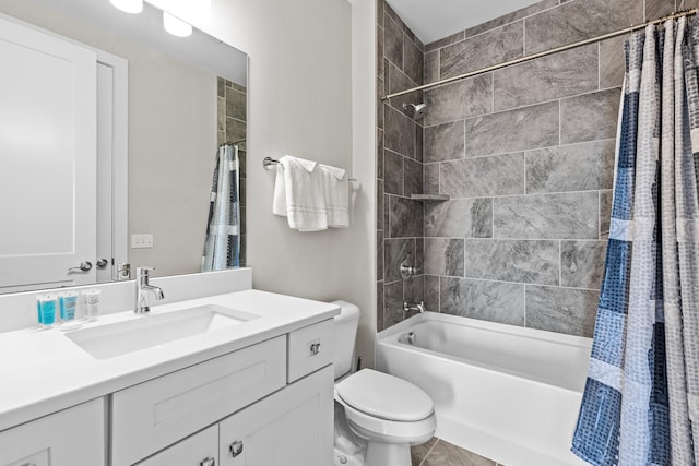 full bathroom with shower / tub combo, vanity, tile patterned flooring, and toilet