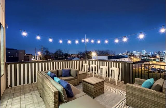 deck at night with an outdoor hangout area