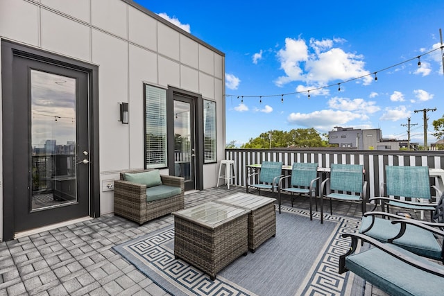 wooden terrace featuring an outdoor hangout area