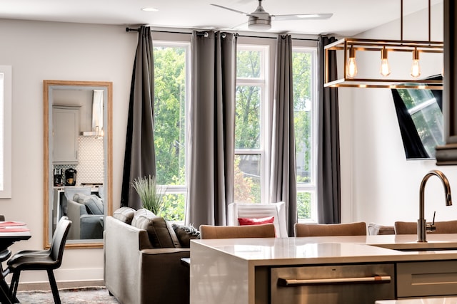 interior space with ceiling fan and sink