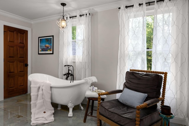 living area with an inviting chandelier and ornamental molding