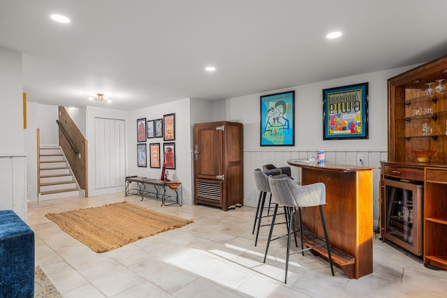 bar featuring light tile patterned floors and beverage cooler