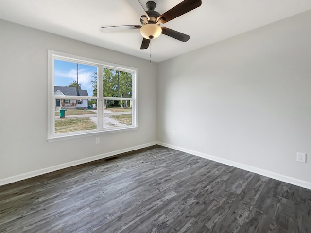 unfurnished room featuring dark hardwood / wood-style flooring and ceiling fan