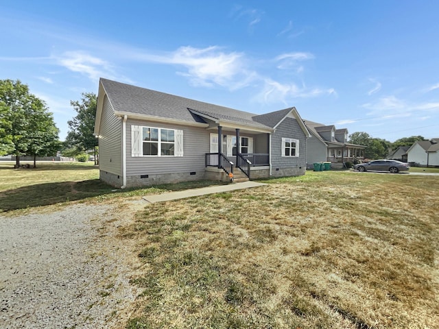 view of front of property with covered porch and a front lawn