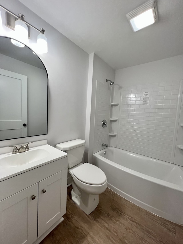 full bathroom featuring vanity, bathtub / shower combination, toilet, and hardwood / wood-style floors