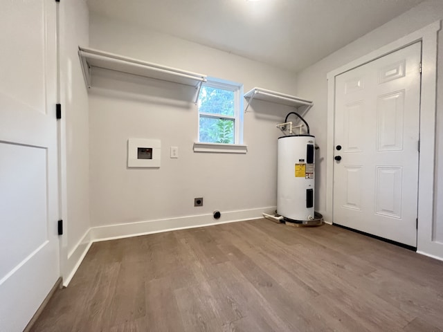 laundry area with water heater, hookup for a washing machine, hookup for an electric dryer, and hardwood / wood-style floors