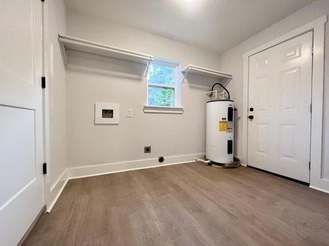 laundry area featuring hardwood / wood-style flooring, hookup for a washing machine, water heater, and electric dryer hookup